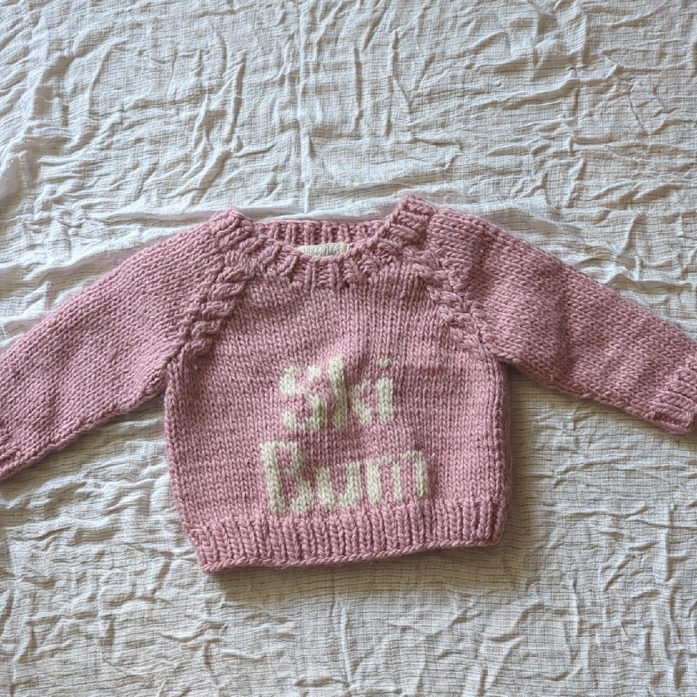 Soft Pink and White Knit Sweater with Decorative Pattern